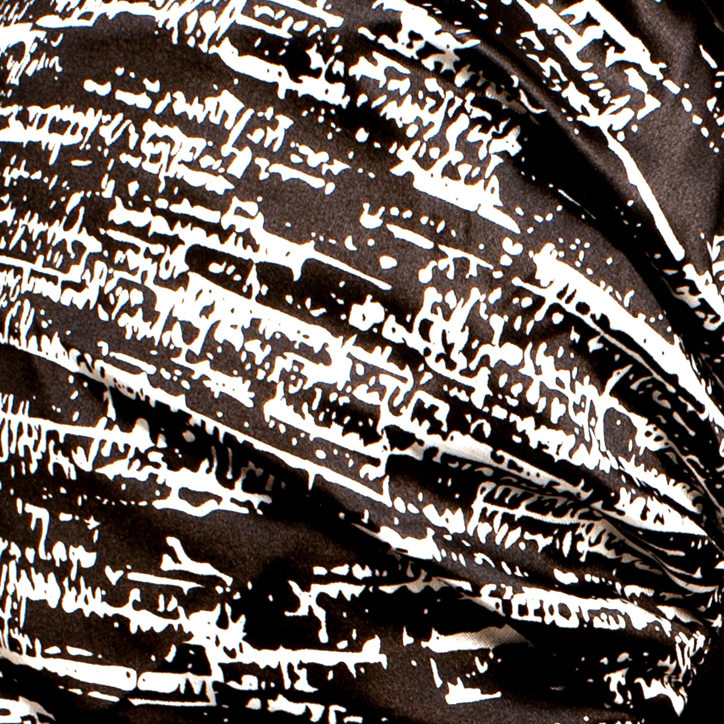 close up of the satin material used to make Evolve's satin Moroccan print bonnet