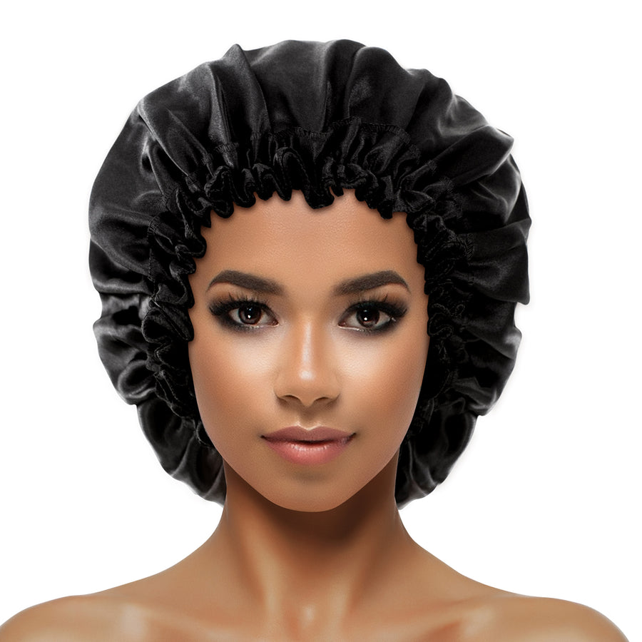 model wearing Evolve's black Onyx satin bonnet