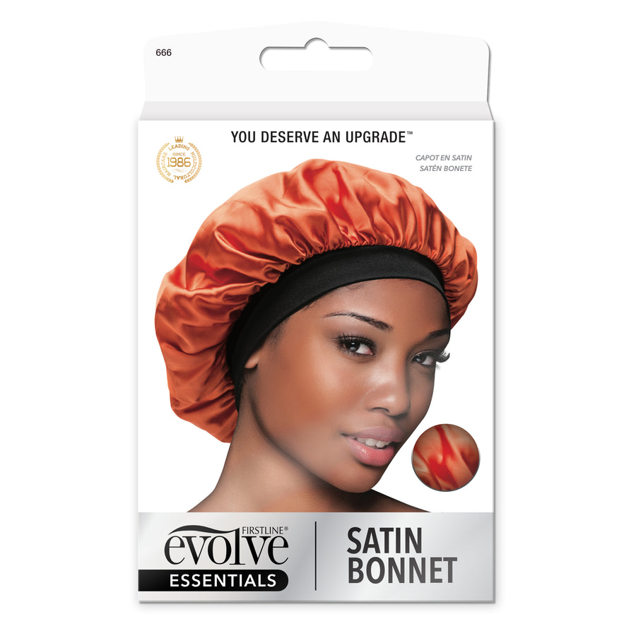 model wearing Evolve's orange satin bonnet with black elastic band on front of product package